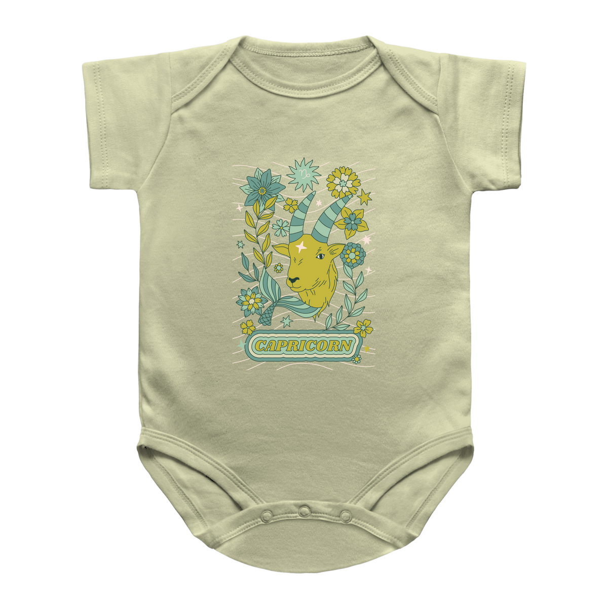 A light yellow short-sleeve baby onesie featuring a colorful graphic of a Capricorn zodiac surrounded by green and yellow flowers, with the word &