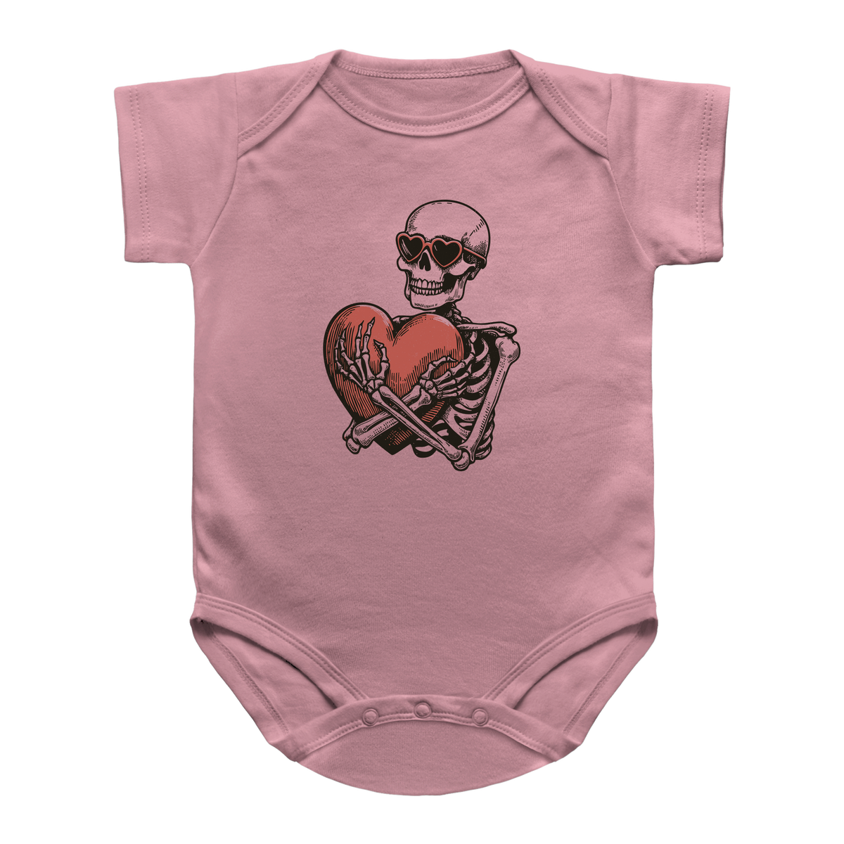 A pink baby onesie featuring a graphic print of a Halloween skeleton wearing sunglasses and hugging a red heart.