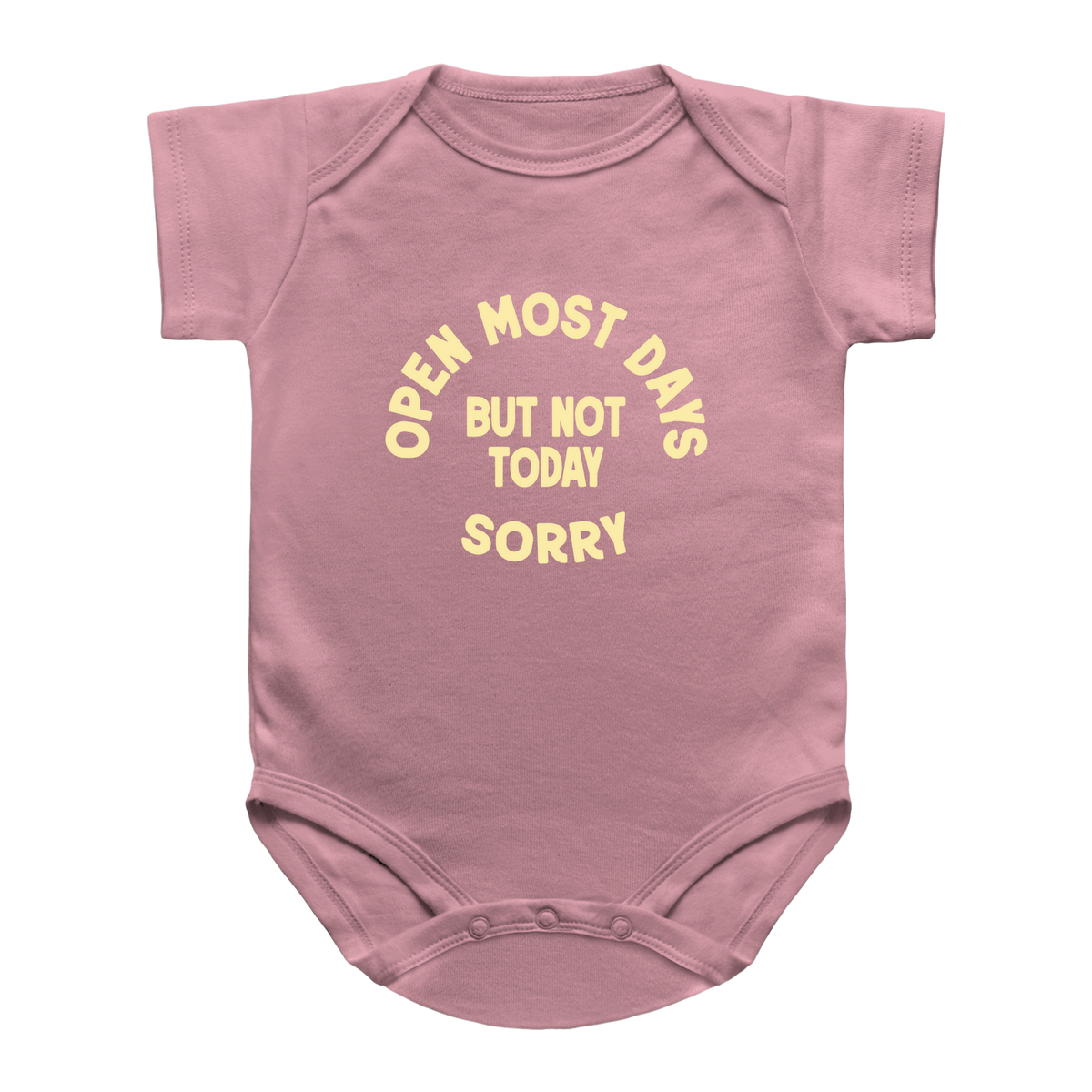 A dusty pink baby bodysuit with short sleeves and a yellow printed text graphic on the chest that reads &