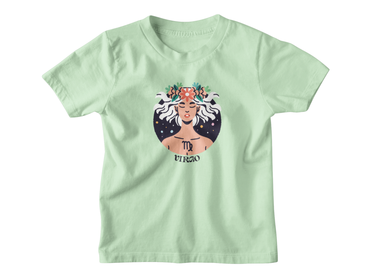 A light green short-sleeve t-shirt with a graphic of the Virgo astrology sign, featuring an illustrated figure with white hair, a floral crown, and a starry background.