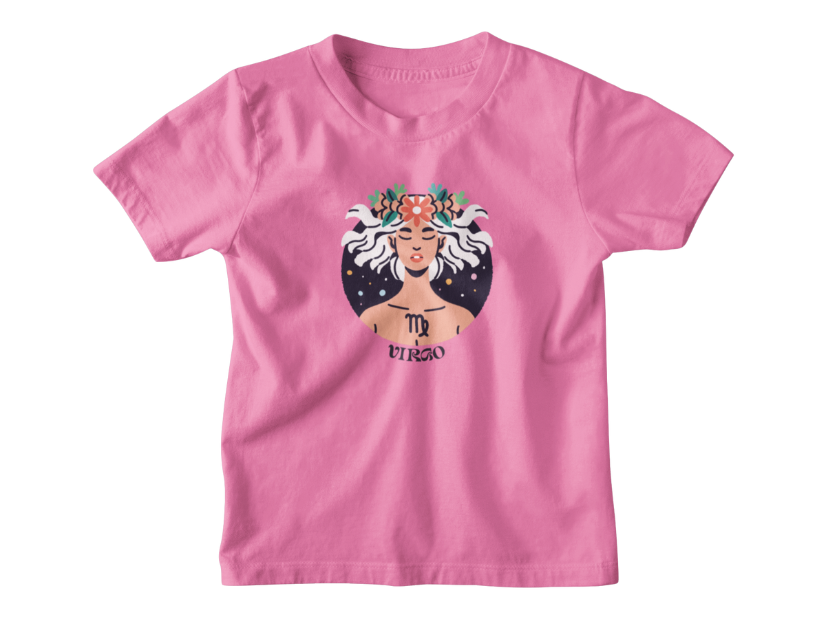 A bright pink short-sleeve t-shirt with a graphic of the Virgo zodiac sign, featuring an illustrated figure with white hair, a floral crown, and a starry background.