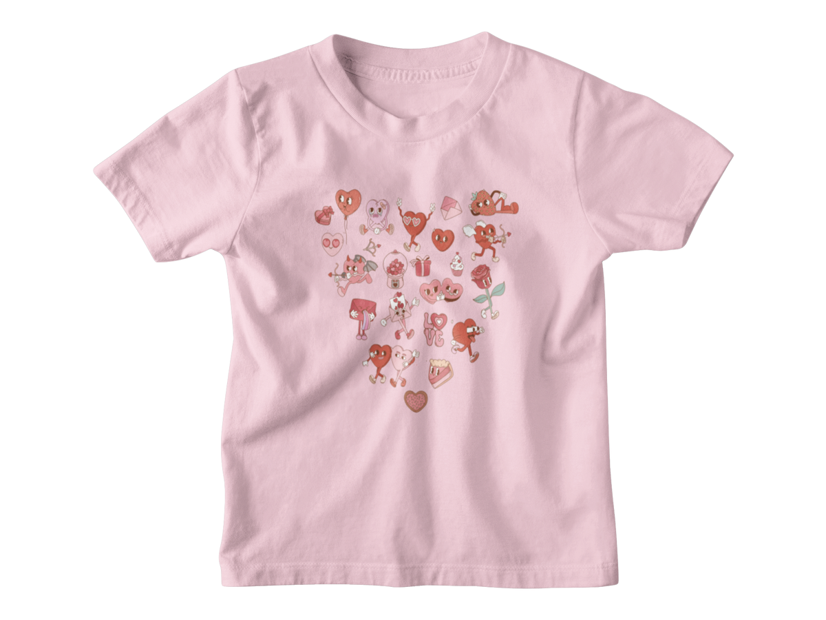 A light pink short-sleeve kids tee with a heart-shaped graphic on the chest made of small red and pink Valentine&