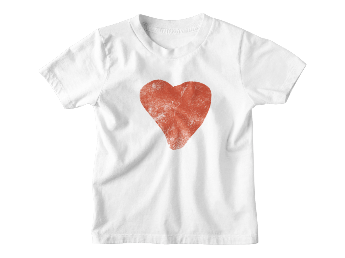 A white short-sleeve kids t-shirt featuring a textured red heart graphic printed on the center chest, meant for Valentine&