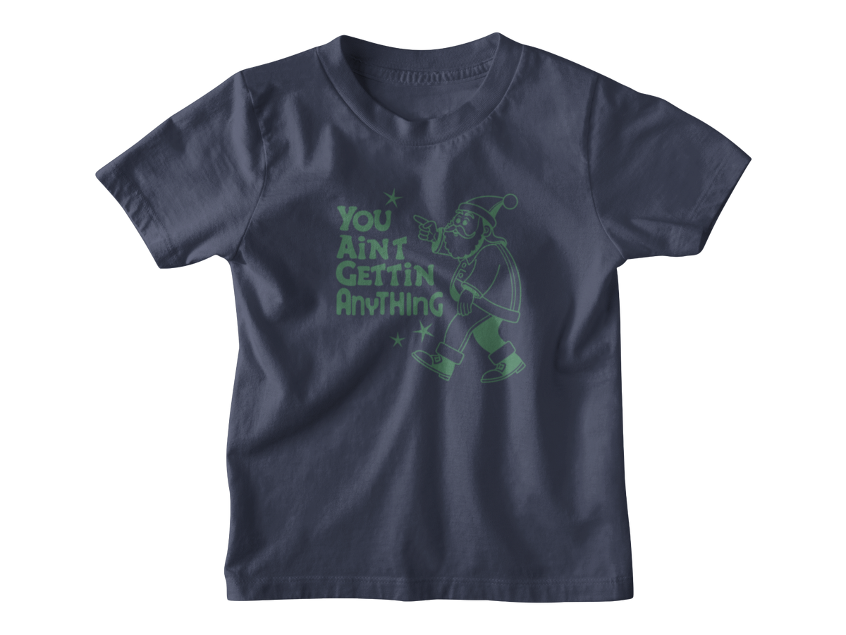 A Christmas navy blue kid tee with a green graphic of a Santa Clause pointing and the text &