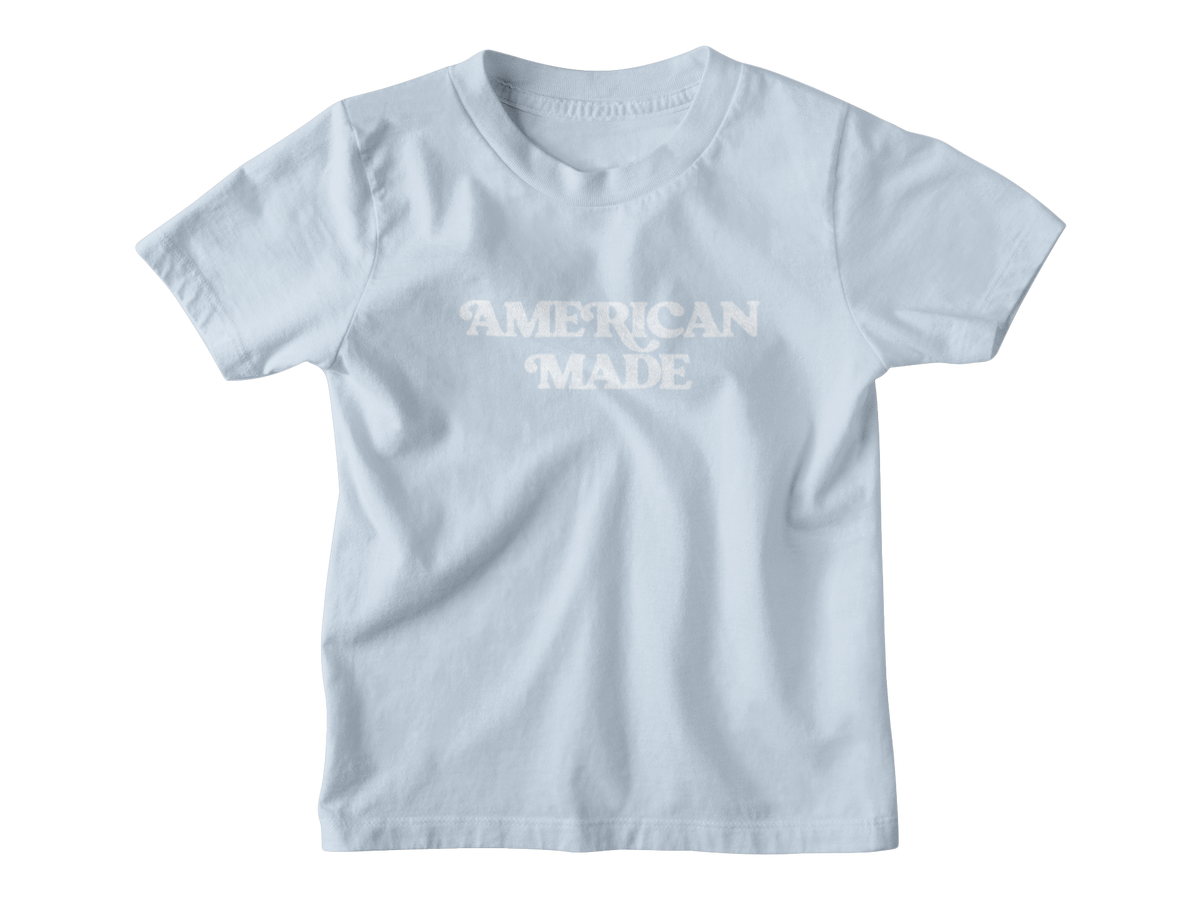 A light blue short-sleeve crewneck kids t-shirt with &