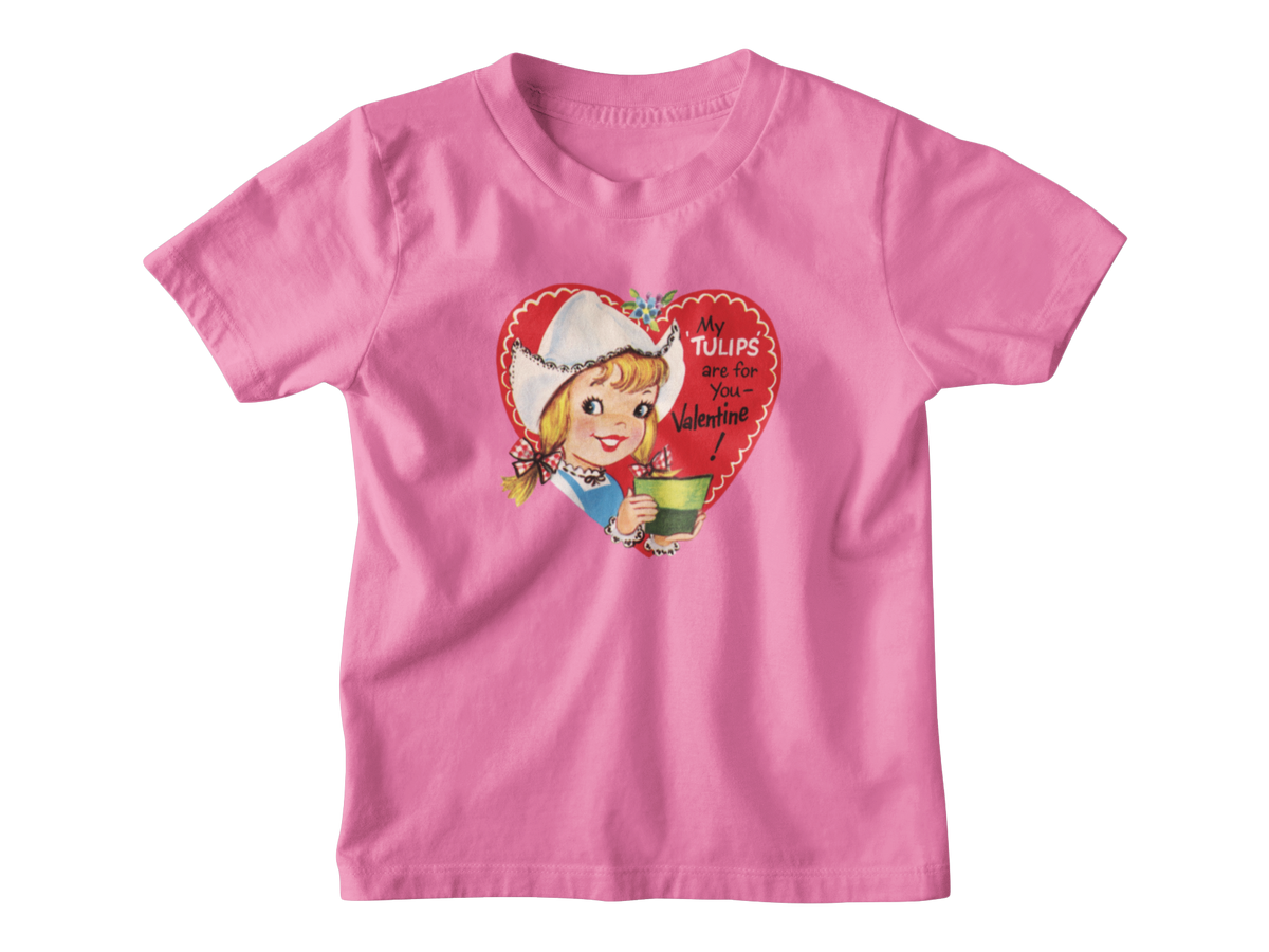 A bright pink short-sleeve kids t-shirt with a vintage-style red heart Valentine with the text &
