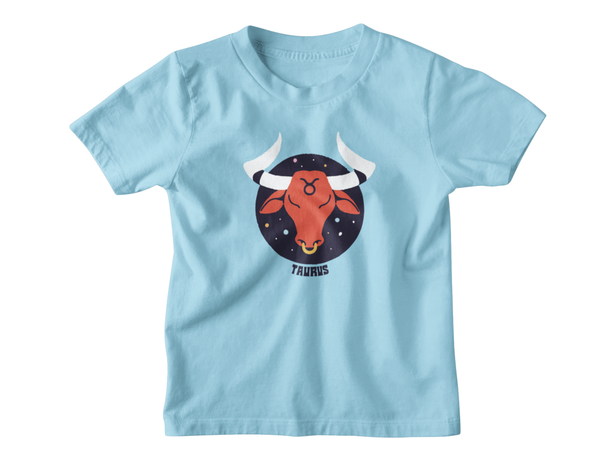 A light blue short-sleeve kids t-shirt with a graphic of a red bull head inside a dark blue starry circle, labeled &