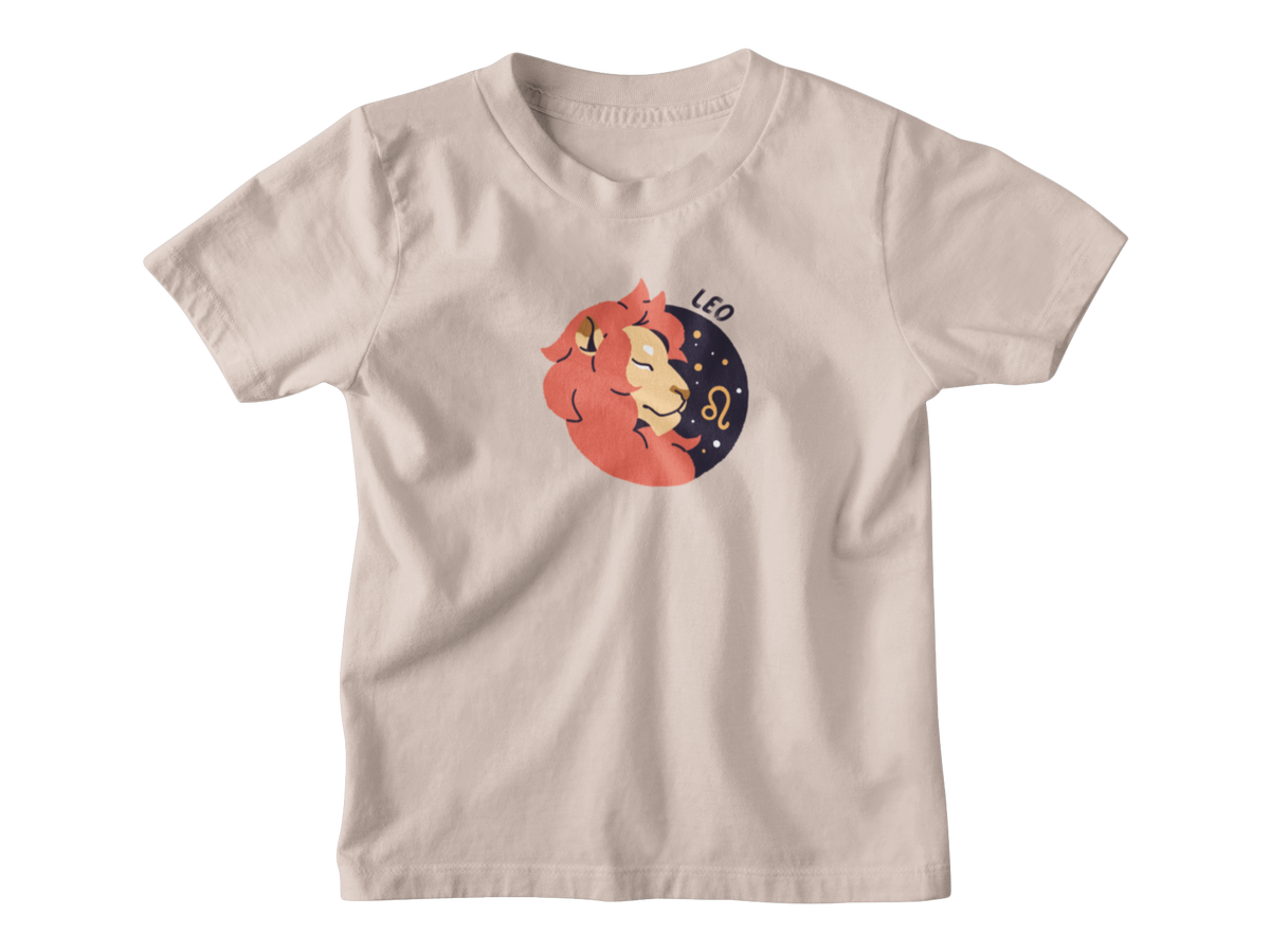 A light beige crewneck t-shirt featuring a cartoon graphic of a Leo zodiac sign embracing a crescent moon, with the text &