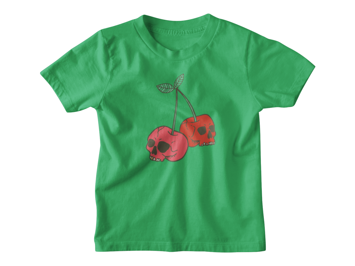 A green short-sleeve kids t-shirt featuring a graphic of two red cherries with skull faces and green stems, displayed on a clean white background.