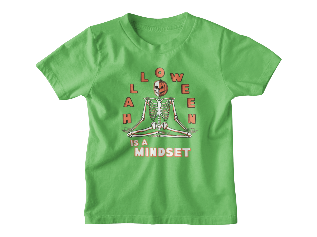 A green short-sleeve kids Halloween t-shirt with a graphic on the front showing a skeleton meditating inside a jack-o&