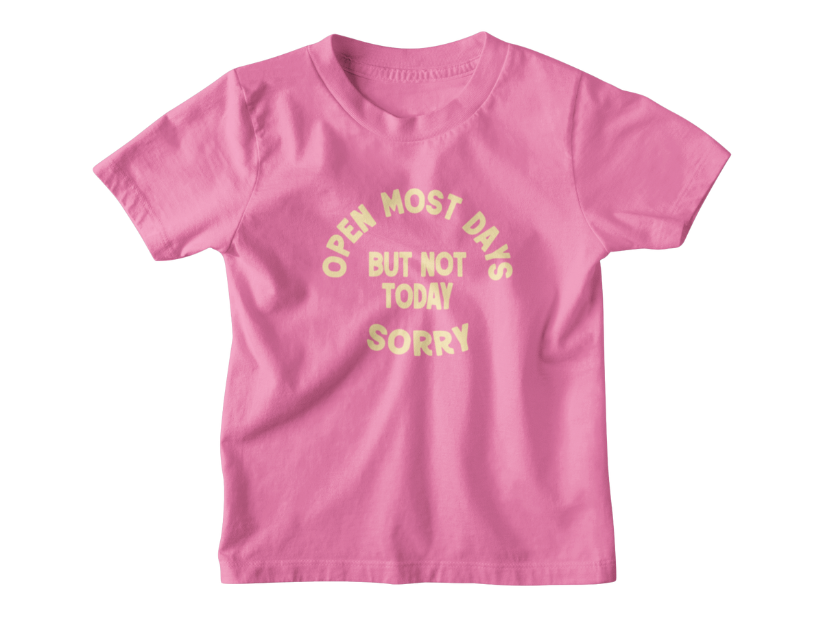 A pink short-sleeve crewneck kid t-shirt with a light yellow text graphic on the front that reads &