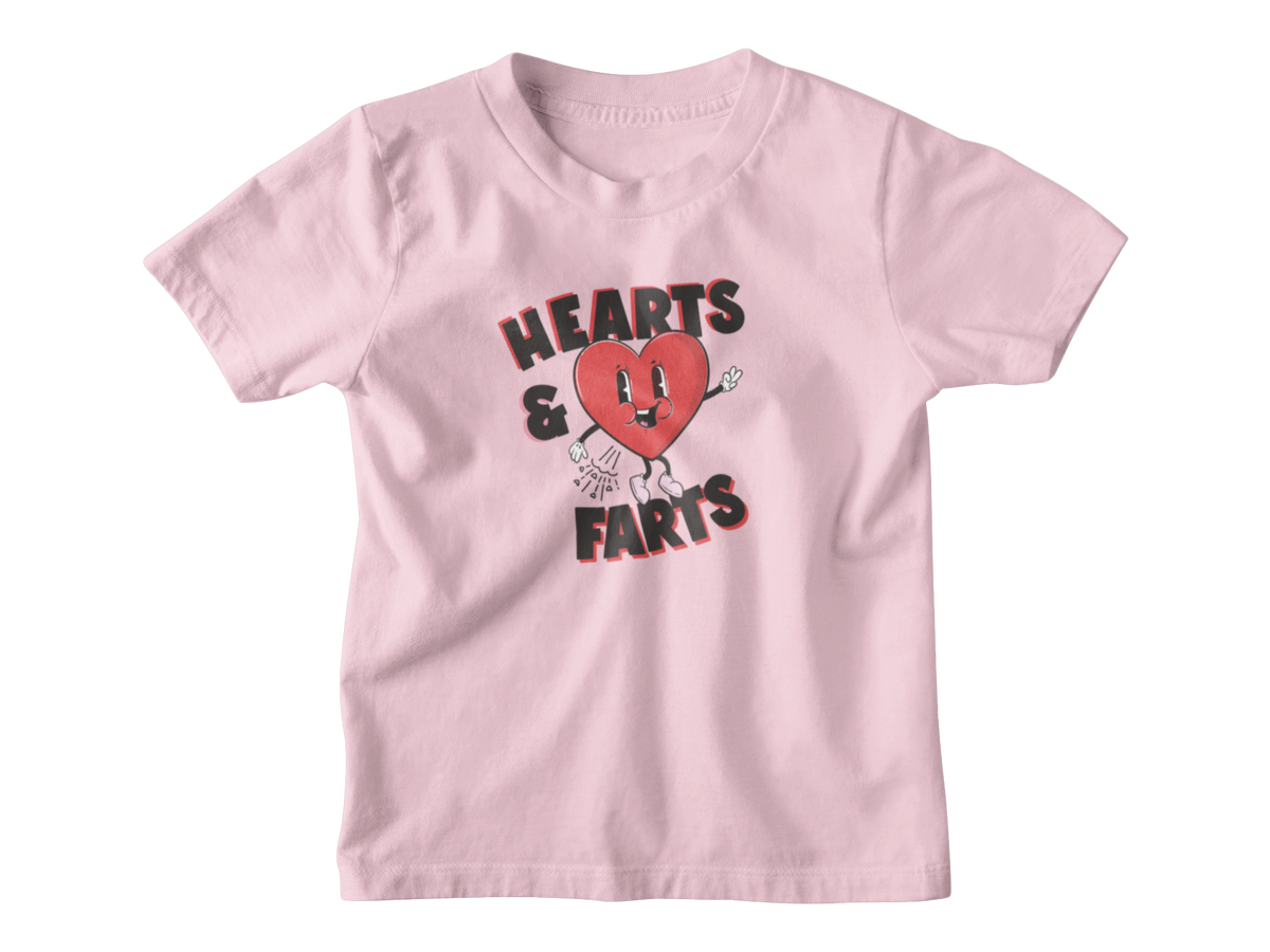Light pink kids shirt with a heart that says Hearts and Farts.