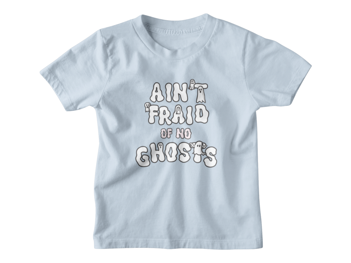 A light blue short-sleeve kid t-shirt with a white graphic Halloween text print that reads &