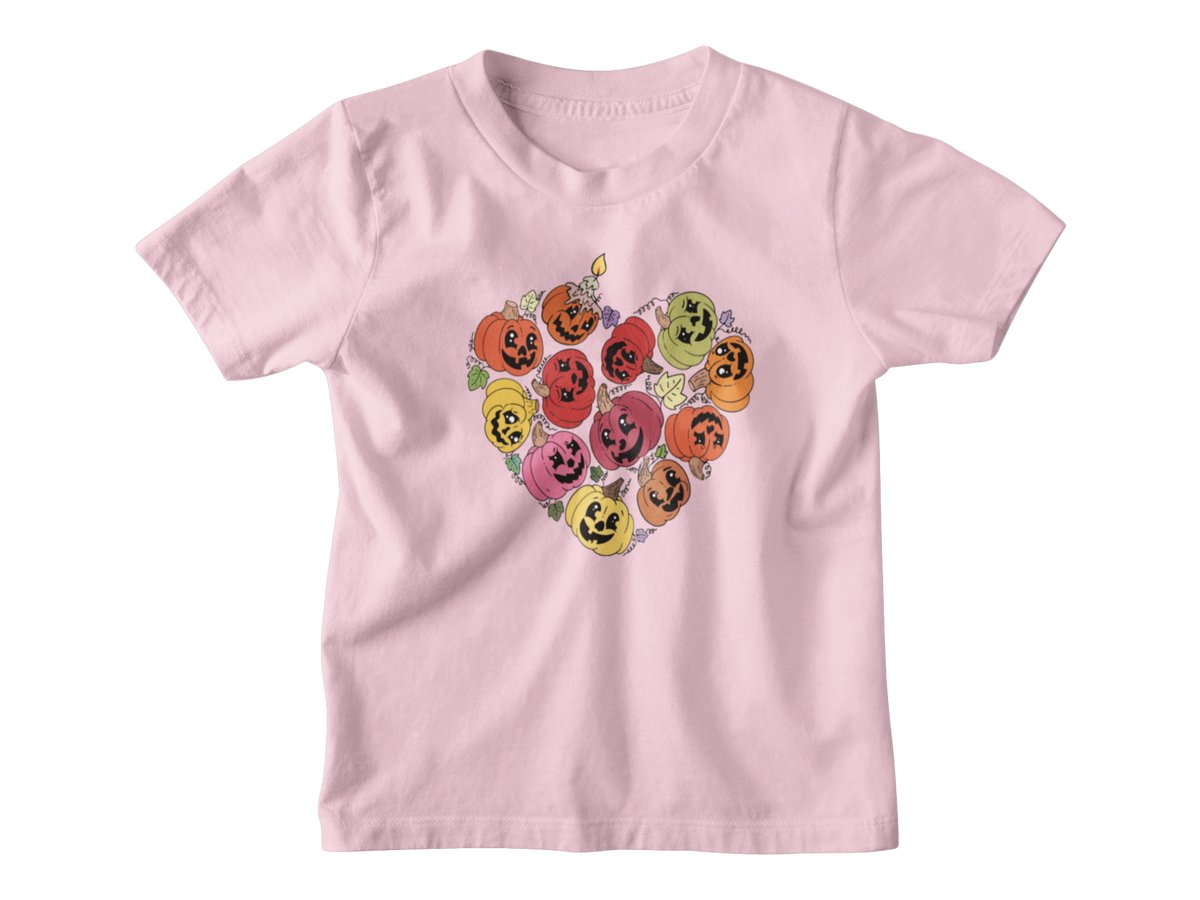 A pink short-sleeve kids t-shirt with a heart-shaped graphic of smiling jack-o&