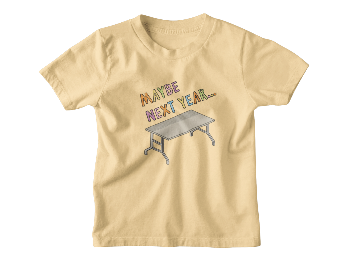 A light yellow short-sleeve kids t-shirt with a graphic print on the front that reads &