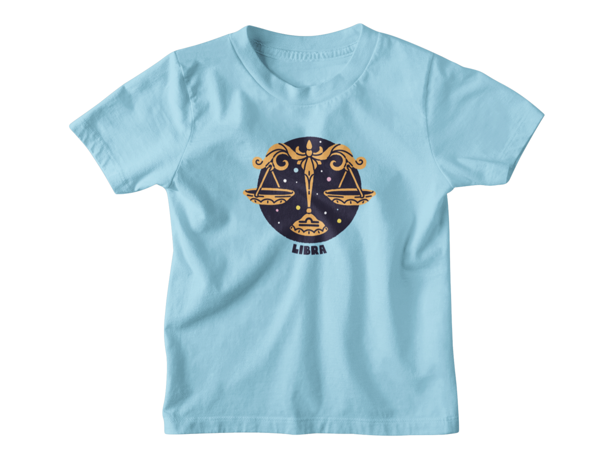 A light blue short-sleeve t-shirt with a Libra zodiac graphic on the chest, featuring a gold and navy design with the word &