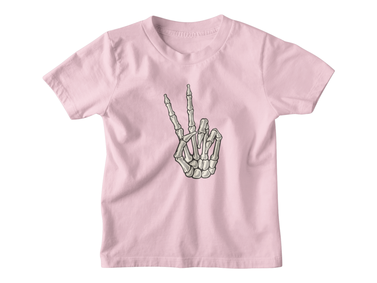 A pink short-sleeve crewneck kid t-shirt featuring a Halloween graphic of a skeletal hand making the middle finger, displayed on a clean white background.