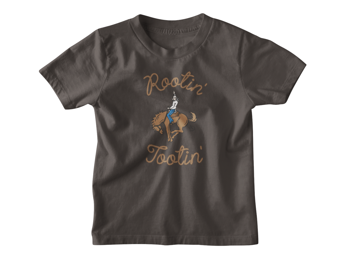 A dark brown kids short-sleeve t-shirt with a graphic of a cowboy riding a bucking horse, surrounded by the words &