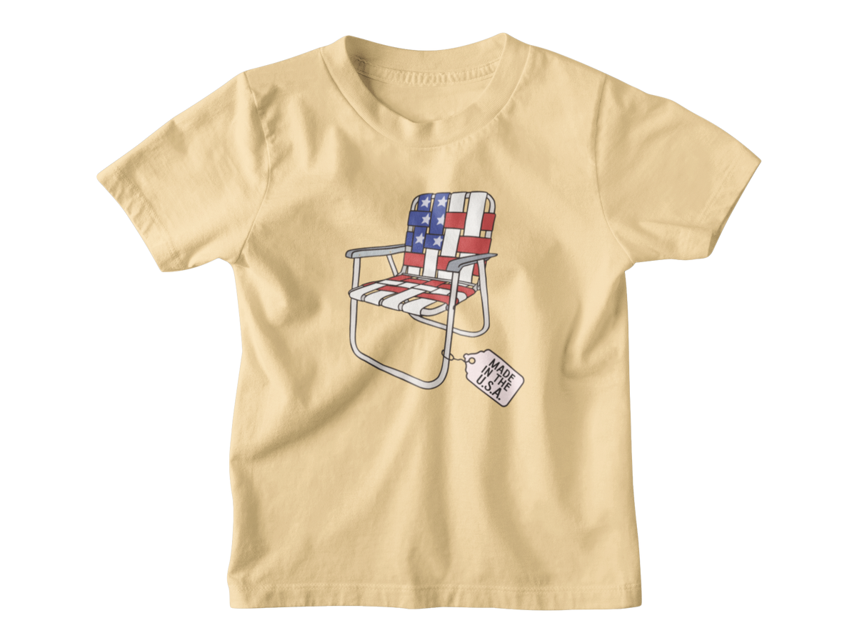A yellow short-sleeve kids t-shirt for 4th of July with a folding lawn chair featuring an American flag pattern, with a &