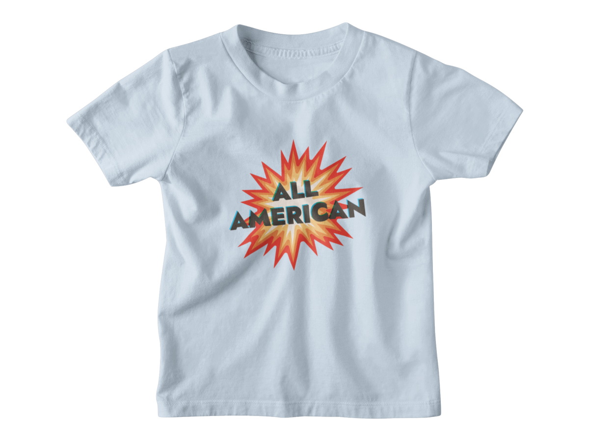 A light blue short-sleeve kids t-shirt with a graphic on the chest featuring a 4th of July firework with the text &
