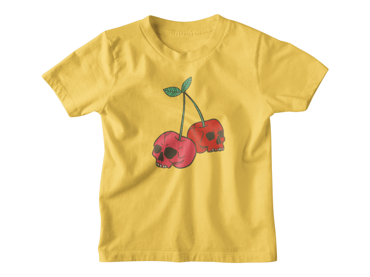 A bright yellow short-sleeve kids t-shirt featuring a graphic of two red cherries with skull faces and green stems, displayed on a clean white background.