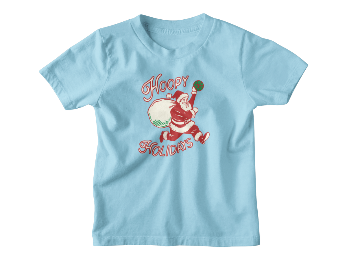 A light blue short-sleeve t-shirt with a vintage-style Christmas graphic of Santa Claus running while carrying a sack, with the words &