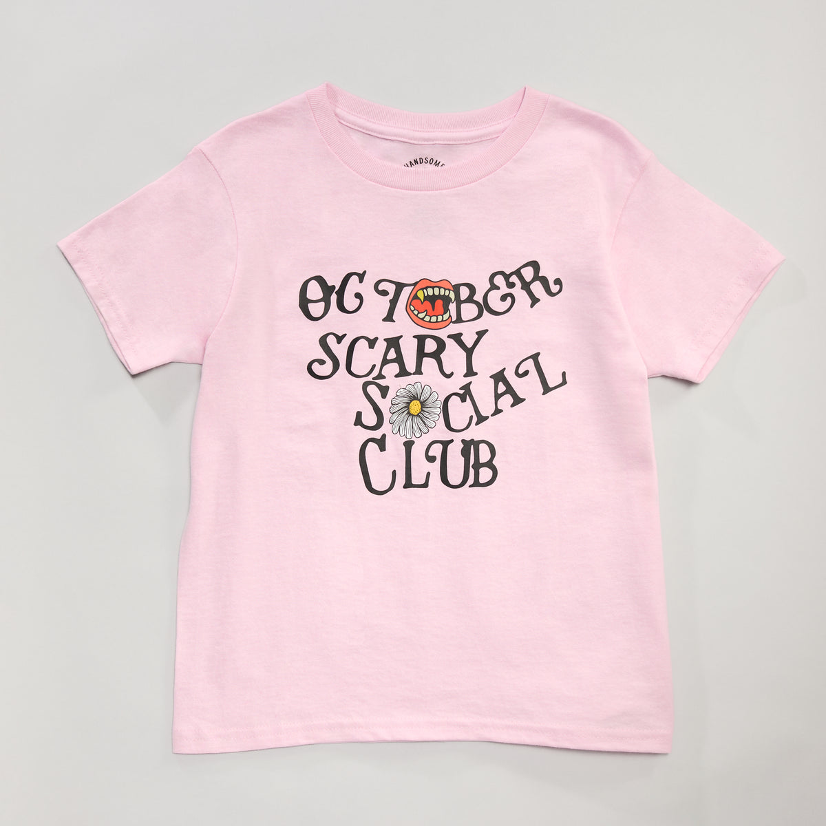 A light pink short-sleeve t-shirt with a graphic on the front reading &