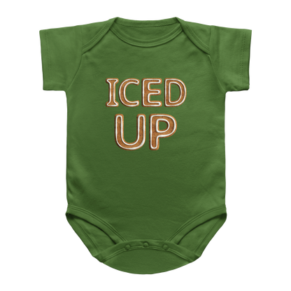 A green baby bodysuit with the words &