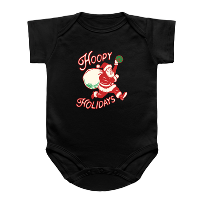 A black short-sleeve infant onesie featuring a vintage-style graphic of Santa Claus dunking a basketball with the text &