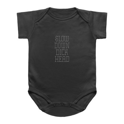 A dark charcoal gray infant onesie with short sleeves and a crew neck, featuring the text &