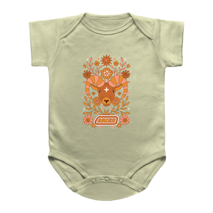 A natural baby infant bodysuit featuring a retro-style orange and brown ram graphic with floral elements and the word Aries on the front, displayed against a plain white background.