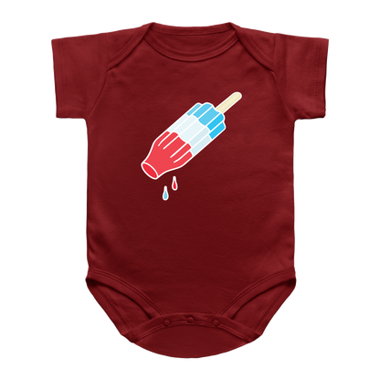 A red short-sleeve infant onesie featuring a graphic of a rocket pop with red, white, and blue stripes. Meant for the 4th of July summer.