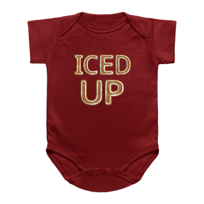 A red infant bodysuit with the words &