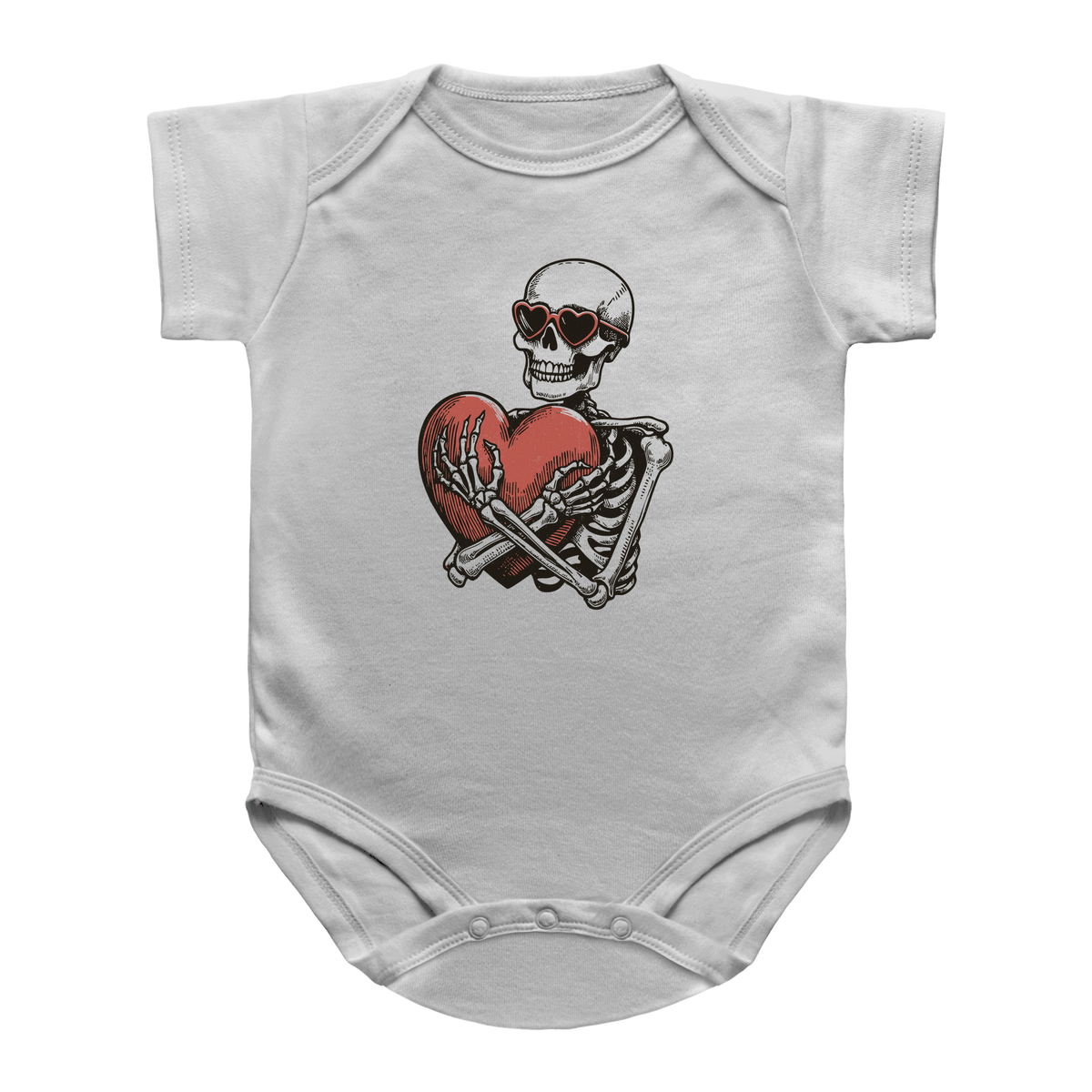A white infant bodysuit featuring a graphic print of a Halloween skeleton wearing sunglasses and hugging a red heart.