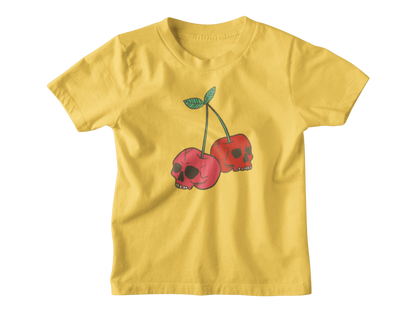 A bright yellow short-sleeve kids t-shirt featuring a graphic of two red cherries with skull faces and green stems, displayed on a clean white background.